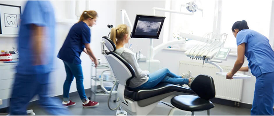 Dental team preparing for treatment